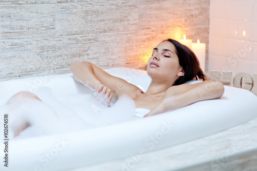 Beautiful woman relaxing in the bathroom 