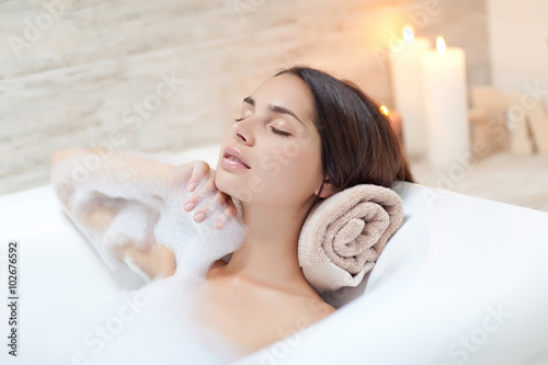 Beautiful woman relaxing in the bathroom 
