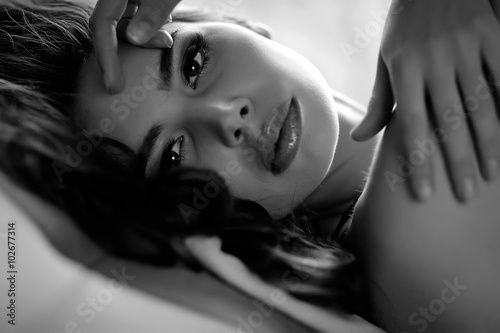Fotografie portrait of sexy woman in bed, bw