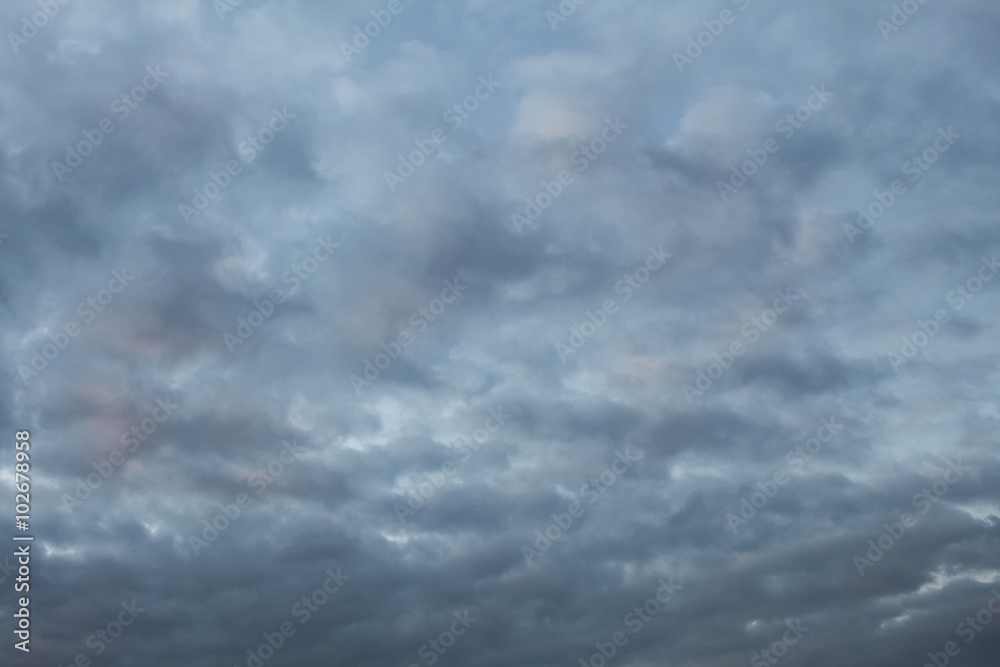 Blue, dark, gray clouds.Sunset. Background Blue, dark, gray clouds.Sunset. Background