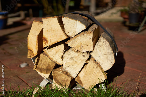 Logs of slitted wood on stretcher / pieces of oak and beech on stretcher photo