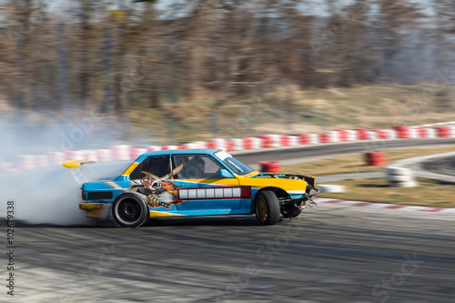 Sport car burnout on the track © niki spasov