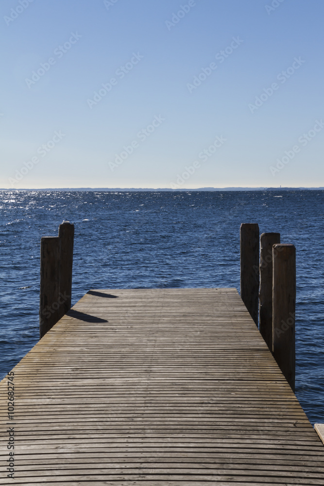Naklejka premium wooden pier on lake