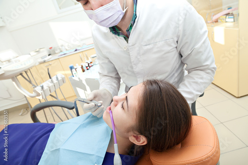 Healthy teeth patient at dentist office dental caries prevention.