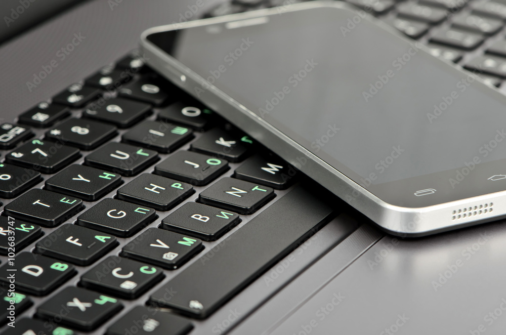Keyboard and smartphone closeup Keyboard and smartphone closeup