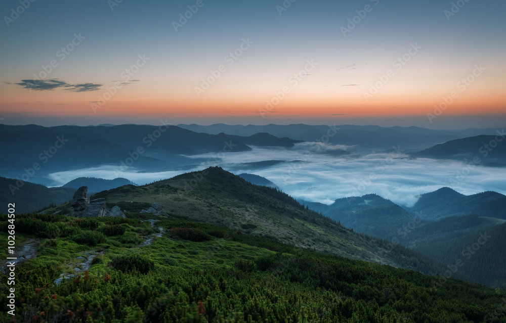 Carpathian Mountains. Sunrise in the mountains with fog