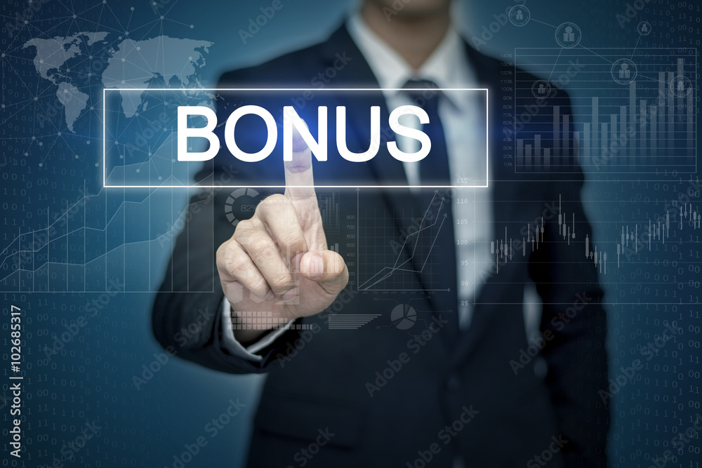 Businessman hand touching BONUS button on virtual screen Businessman hand touching BONUS button on virtual screen