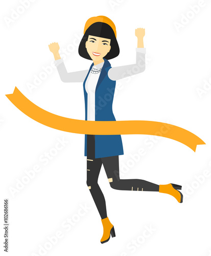 Business woman crossing finish line.