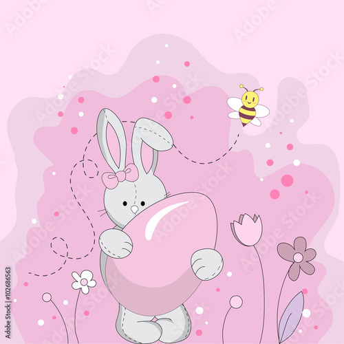 Pink Easter bunny holding a sugar egg
