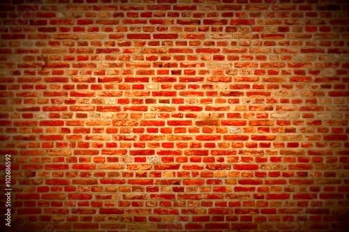 Brick wall horizontal background with red, orange and brown bricks - dark red