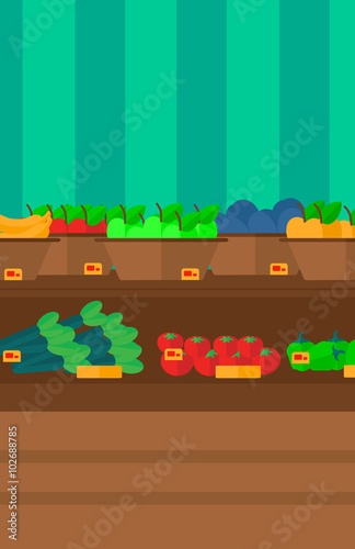 Background of vegetables and fruits on shelves in supermarket.