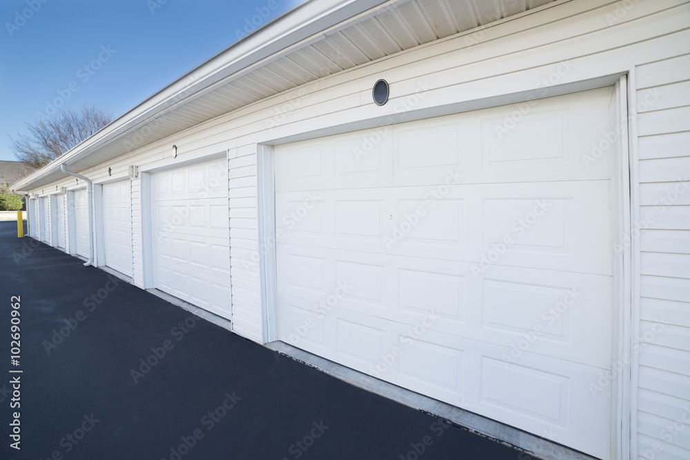 Fototapeta premium Row of garage doors at parking area for apartment homes