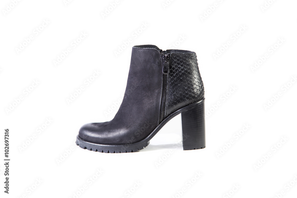 Suede women's boots on a white background, black shoes, autumn and winter, side view Suede women's boots on a white background, black shoes, autumn and winter, side view