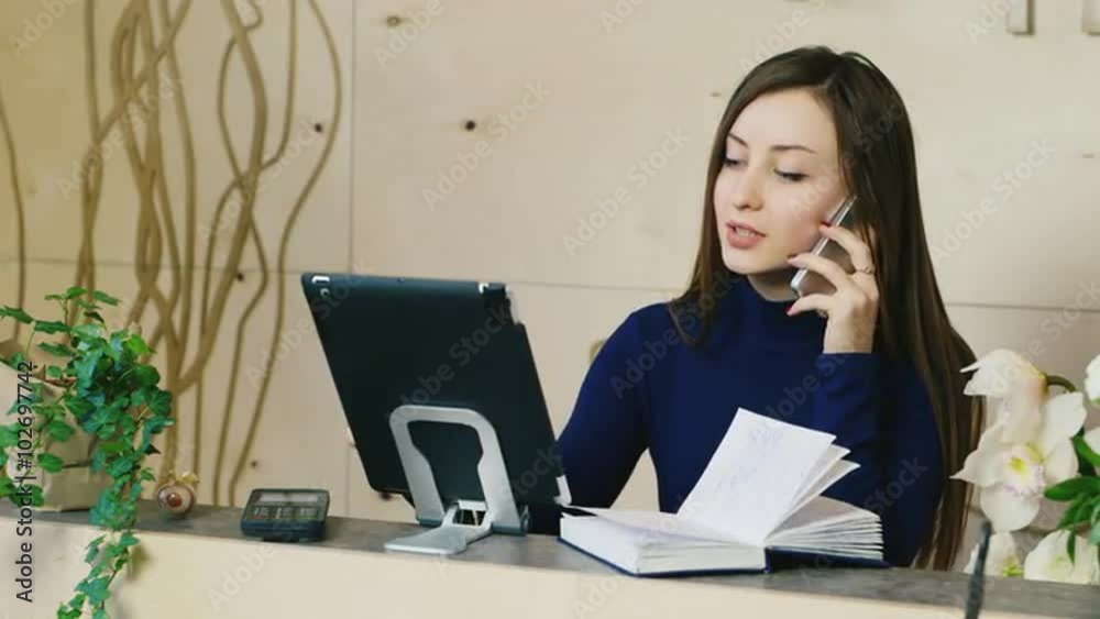 Business woman working at the reception or the hotel company Business woman working at the reception or the hotel company