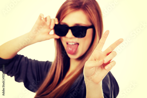 Young teenage woman wearing sunglasses © Piotr Marcinski