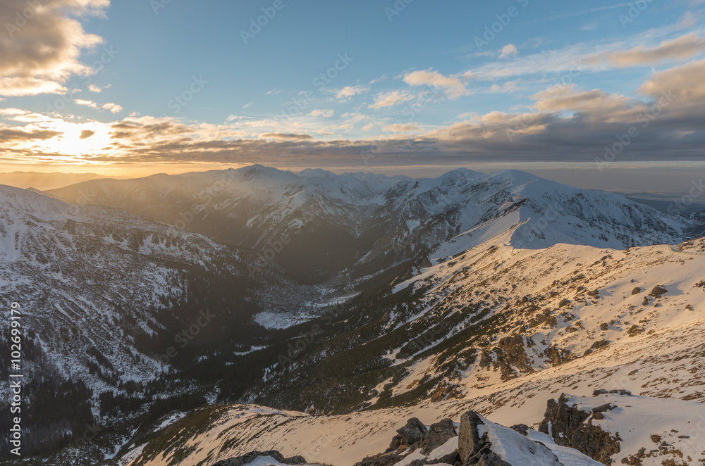 Naklejka premium Colorful mountain sunset panorama at winter in Western Tatras