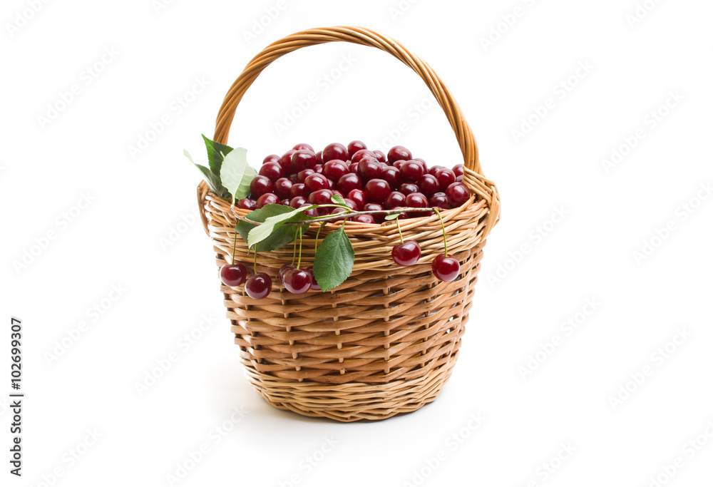 Basket full of fresh red cherry on a white background Basket full of fresh red cherry on a white background