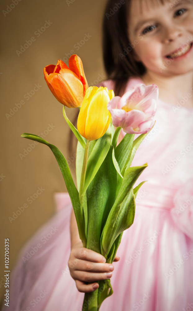 three tulips in the children's hands 