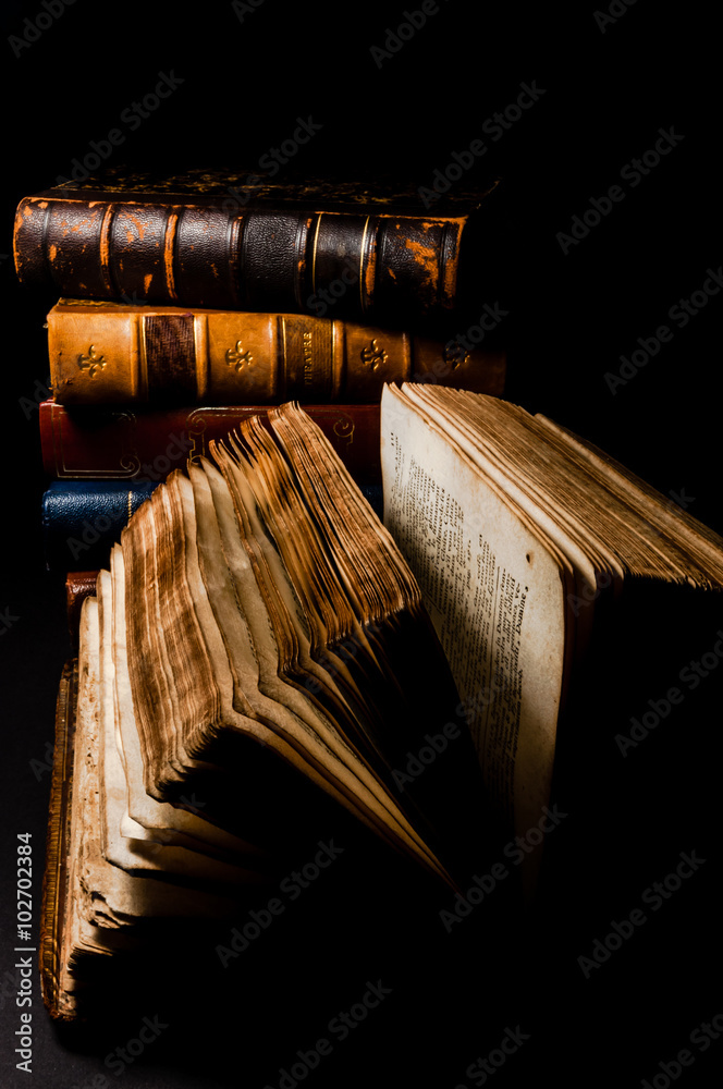 Fototapeta premium Old books in black background
