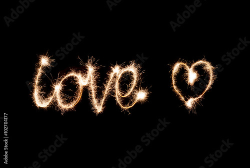 Inscription sparklers Love and heart.