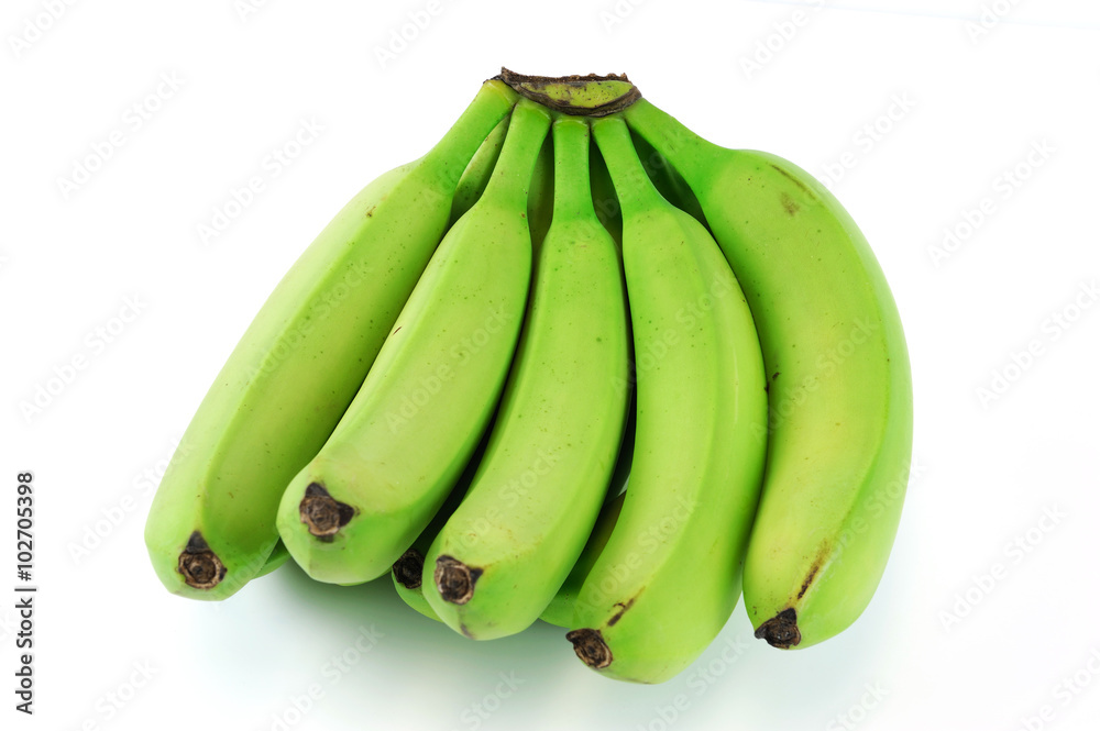 green bananas on white background