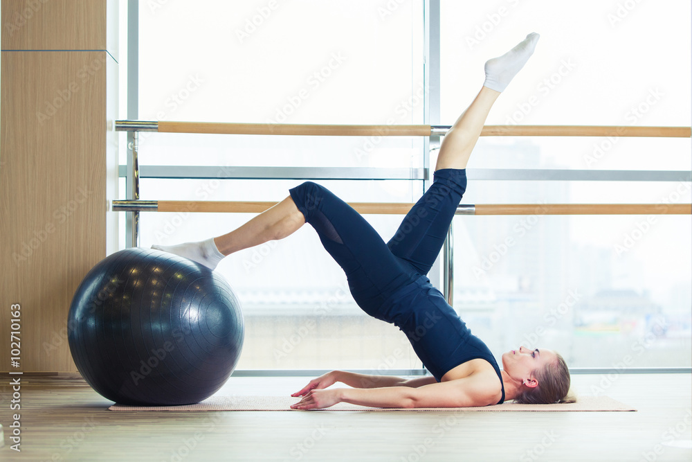 Woman on a fitness ball in  gym