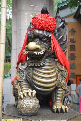 One of Two Dragon Bronze Statue at Main Entrance to Sik Sik Yuen Wong Tai Sin Temple Hong Kong, China  photo