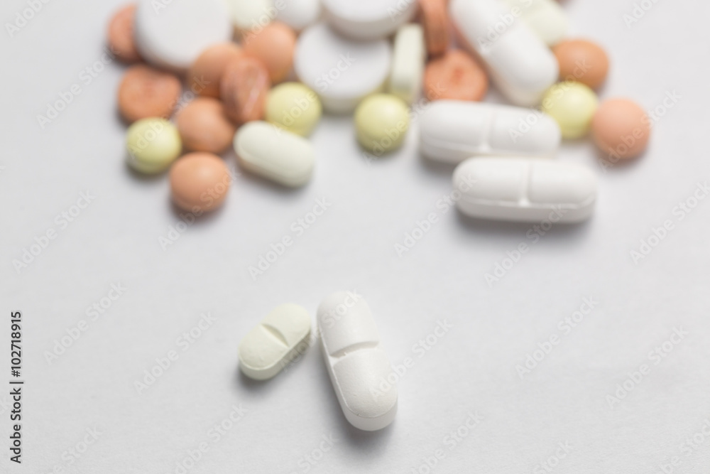 Many colorful pills isolated on white Many colorful pills isolated on white