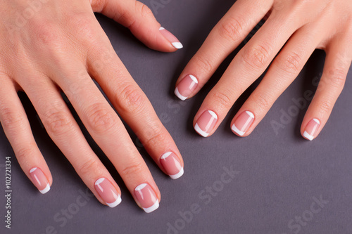 Trendy moon french manicure.