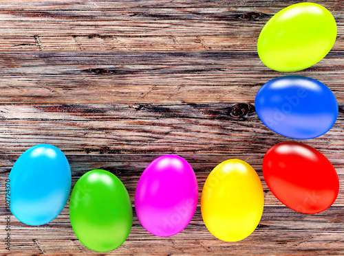 Colorful Easter eggs on a wooden background