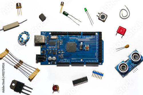 mega board surrounded by components on white background photo