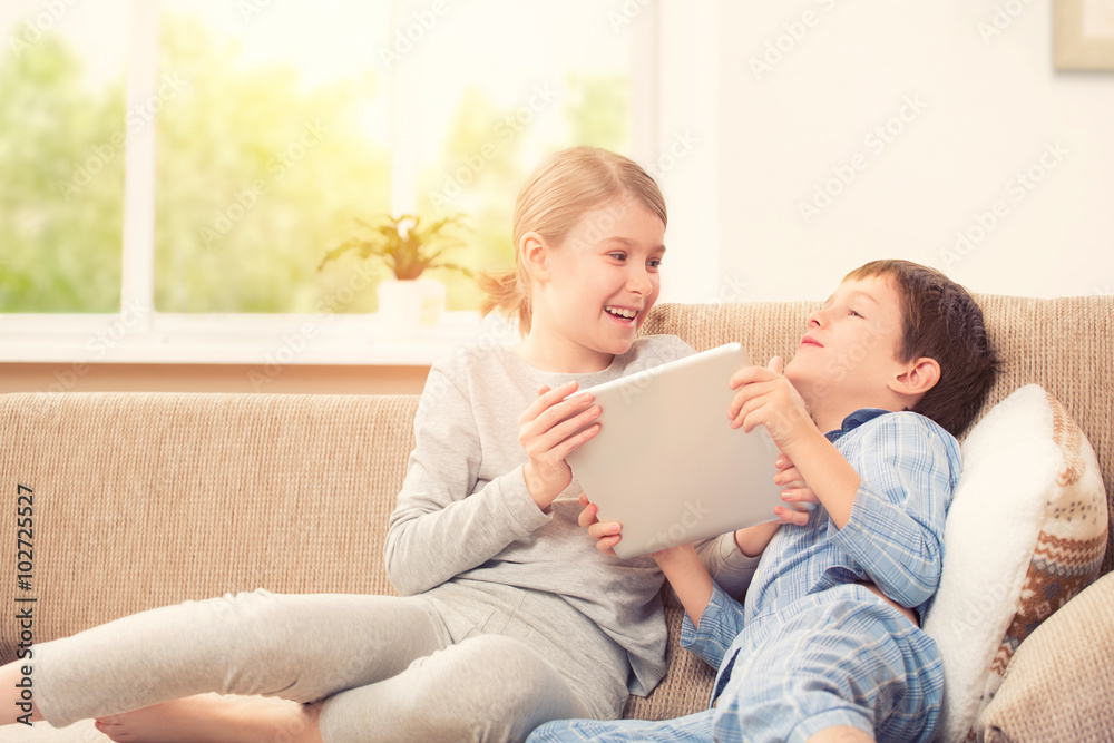 Kids playing with digital tablet