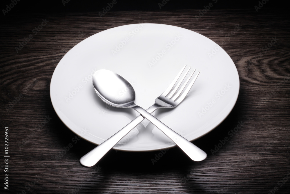a set of cutlery on wooden background a set of cutlery on wooden background
