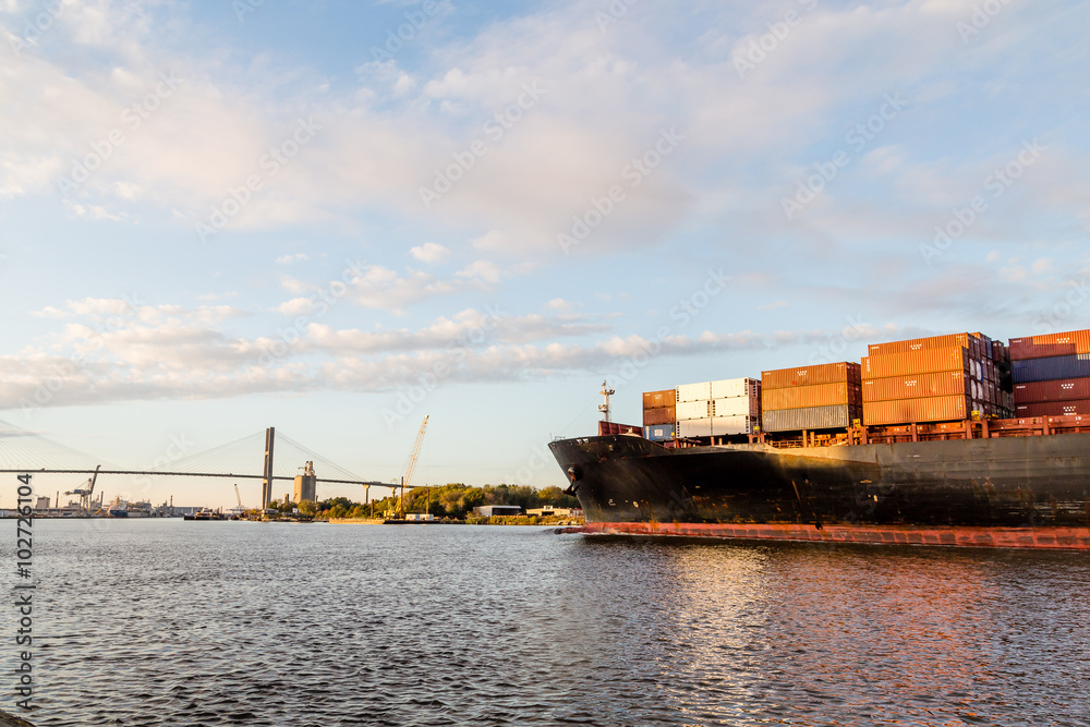 Naklejka premium Full Freighter Heading Toward Bridge