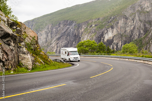 Campervan driving on Hardangervidda road in Norway