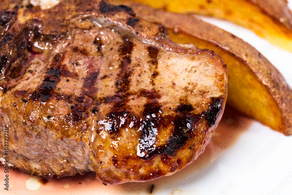 Delicious beef steak with roasted potatoes. Delicious beef steak with roasted potatoes.