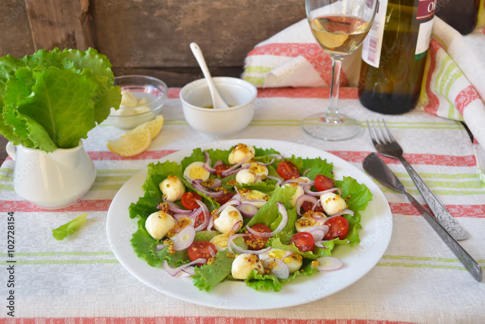 Salad with mozzarella and cherry tomatoes Salad with mozzarella and cherry tomatoes