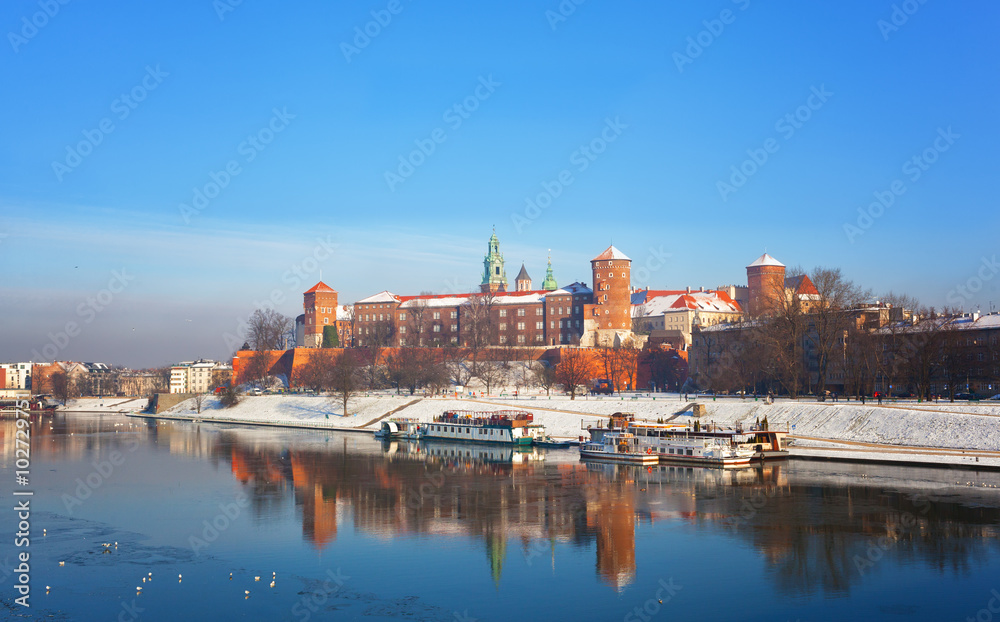 Krakow, a view of the Wawel Castle and its reflection in the river Vistula