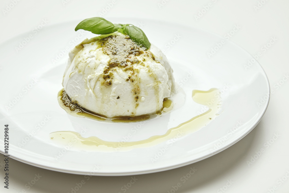 Mozarella with pesto isolated on white Mozarella with pesto isolated on white