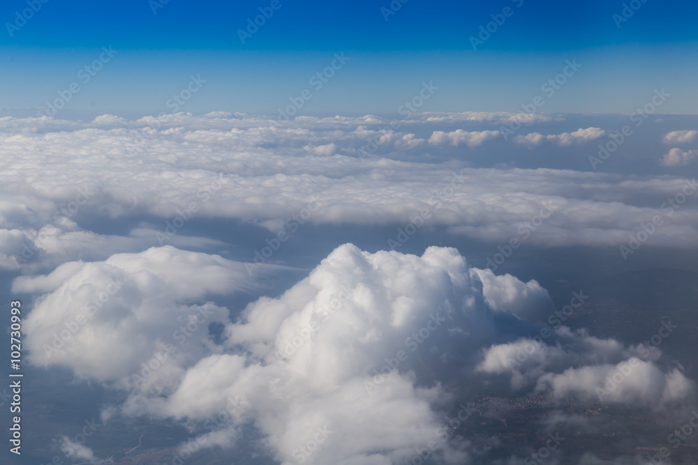 Land view through clouds, aerial photography.