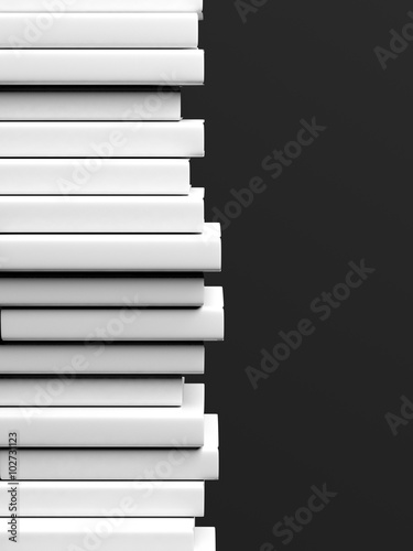 Stack of books with blank hardcover, isolated on black background.