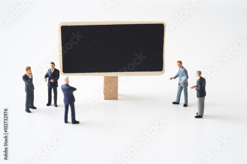 Businessmen meeting at chalkboard © tanawatpontchour