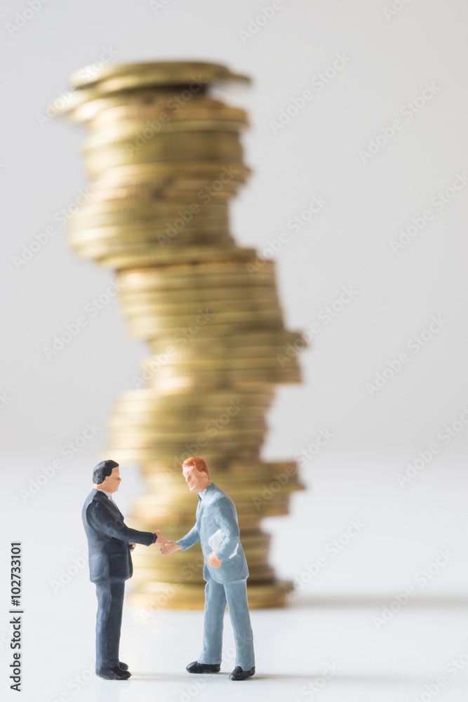 Businessman standing on risky coin stack. Businessman standing on risky coin stack.