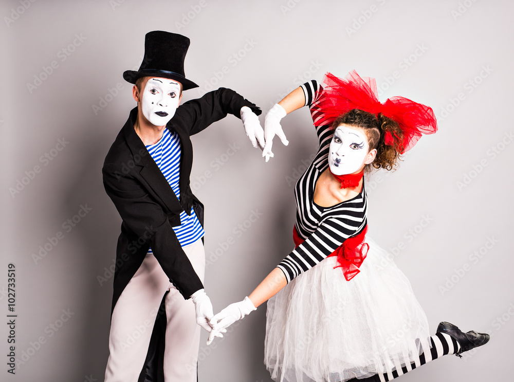 Two mimes shows the heart. Pantomime heart, love concept, April Fools Day concept Two mimes shows the heart. Pantomime heart, love concept, April Fools Day concept
