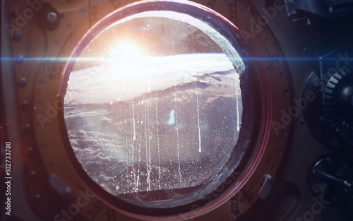 Fototapeta Naklejka Na Ścianę i Meble -  Earth - Beauty of solar system planet in spaceship window porthole. Elements of this image furnished by NASA