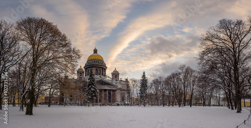 St. Petersburg in the winter. St. Isaac's Cathedral on the background of beautiful sunset sky from the Alexander Garden. Panorama
