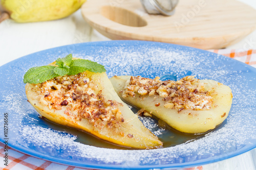 Pear baked with honey, curd cheese and walnut