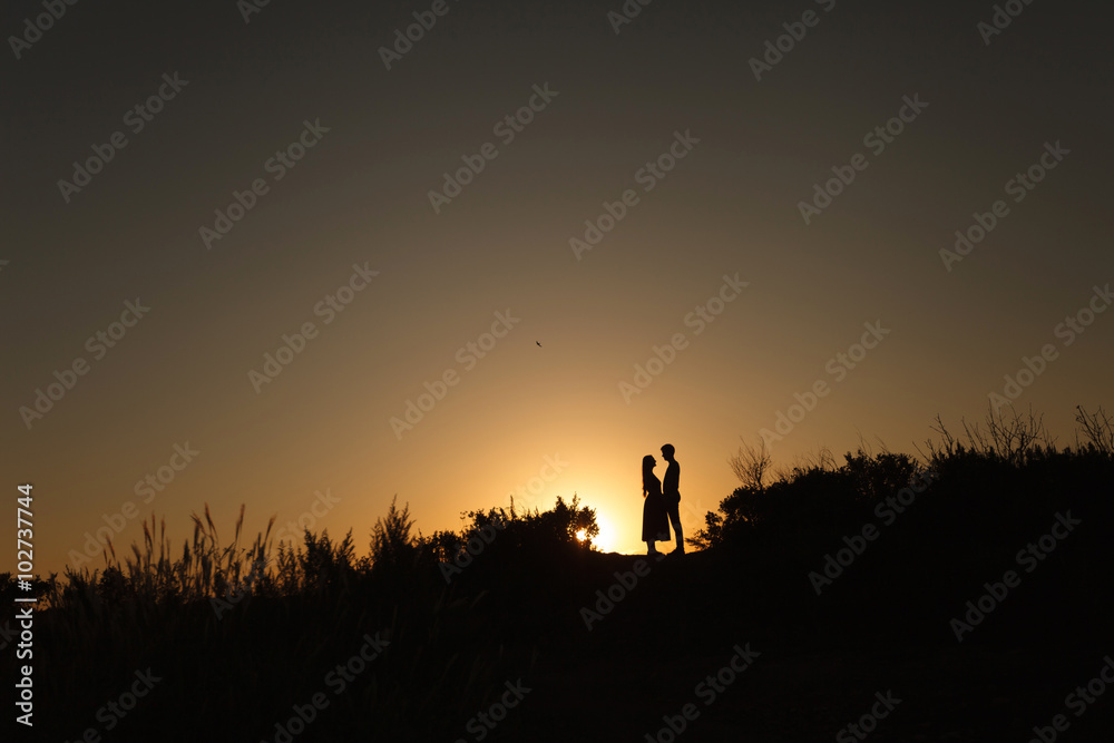 lovers at sunset are facing each other. Love. Relations. Tenderness