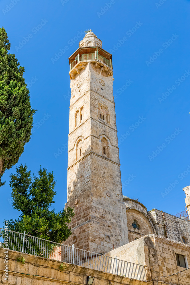 Omer mosque minaret in front of the Church of the Holy Sepulchre in Jerusalem, Israel.