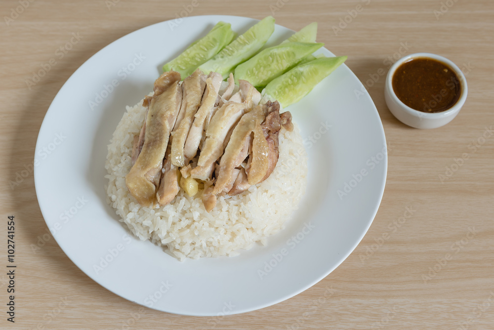 Thai food gourmet steamed chicken with rice , khao mun kai on wood background